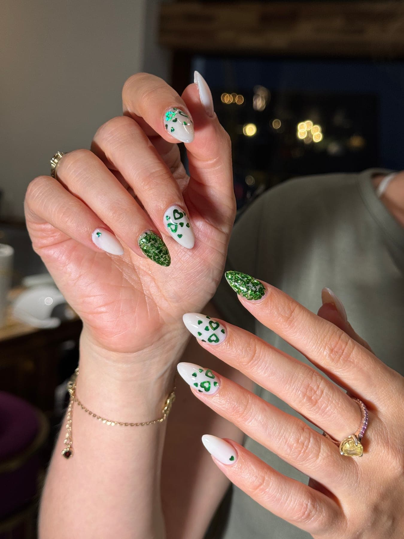 Stiletto nails with a green leopard print